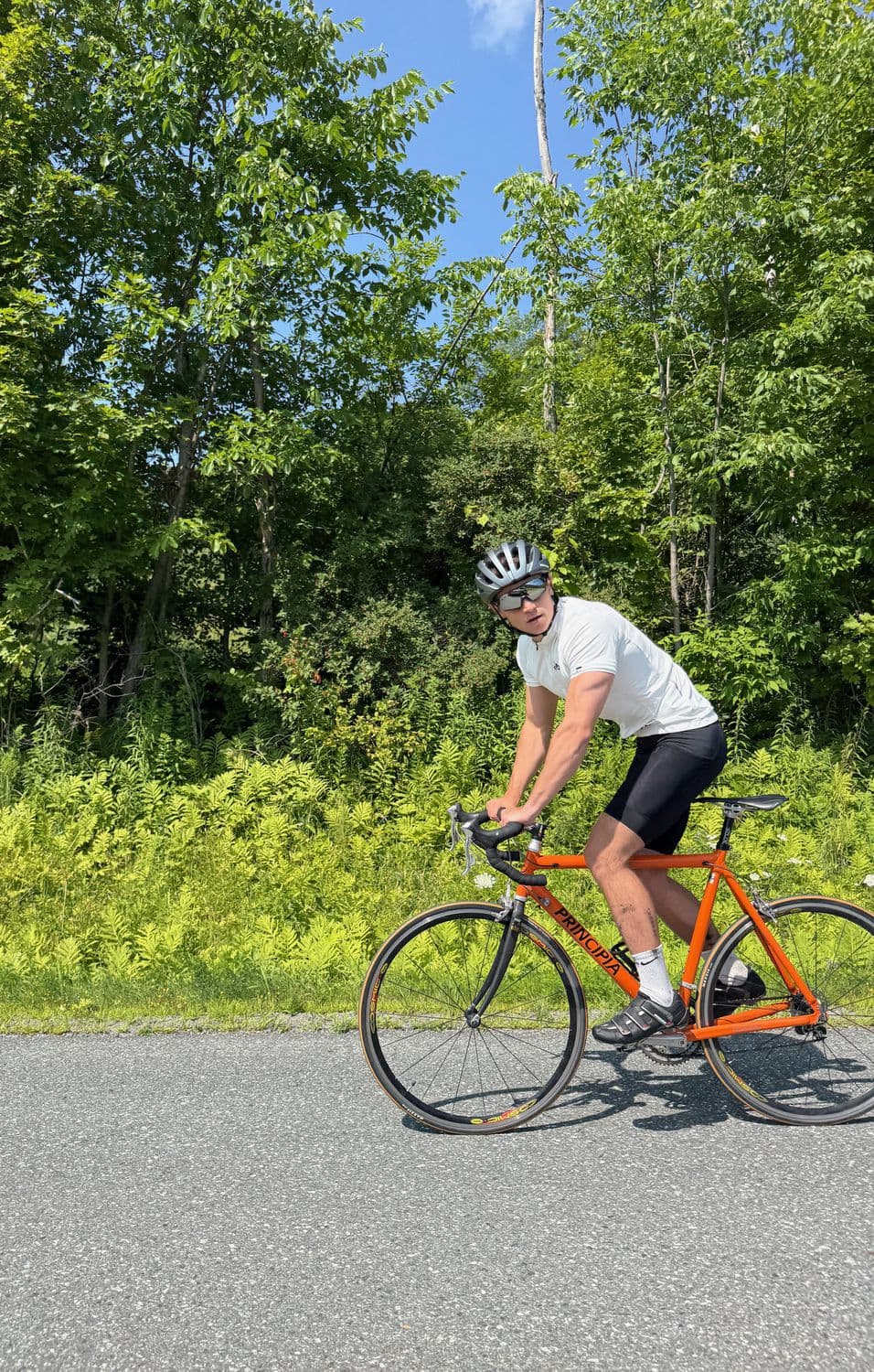 Judson on a road bike in summer
