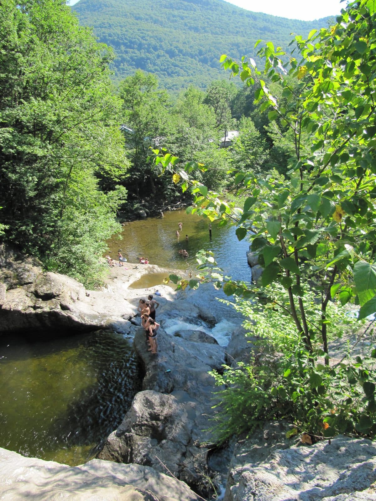 A Vermont swimming hole surrounded by rock and trees