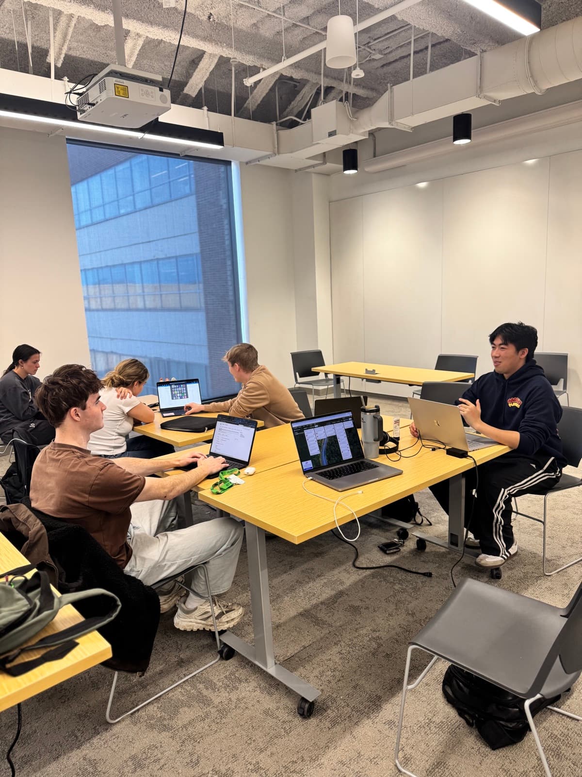 The Insight Lab team working across pushed-together tables