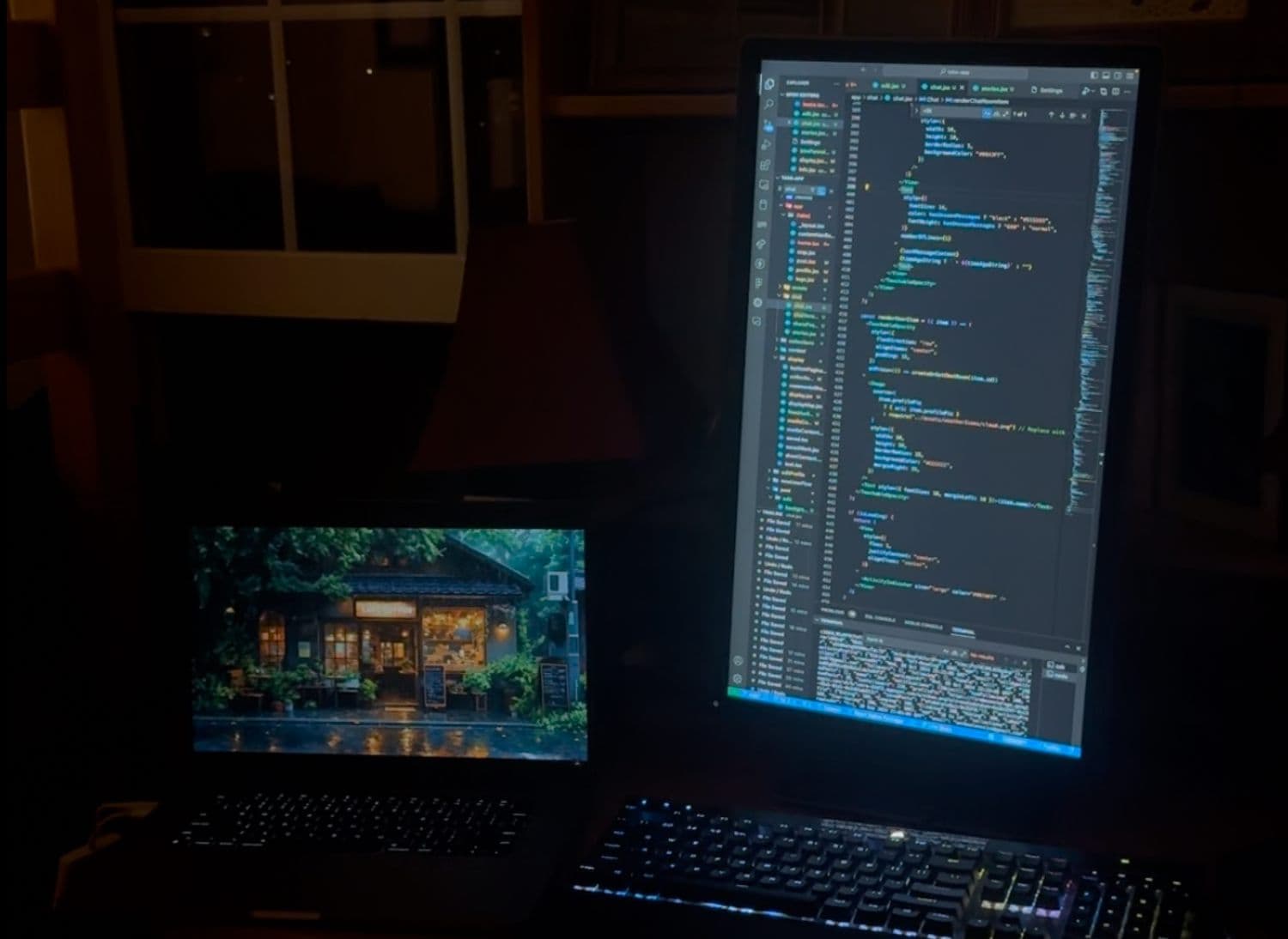 Judson’s desk at night, code across two monitors