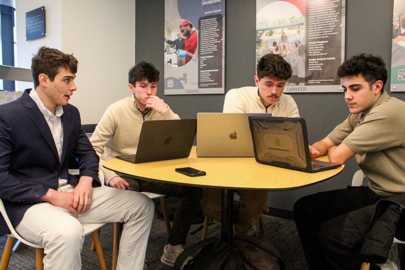 Judson Dunne and the Locava team working across laptops at Lafayette College